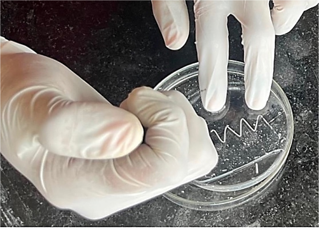 Image shows that removing of ABS using acetone. Acetone was injected from on nozzle forcefully, then acetone dissolves ABS which was pumped out from other nozzle.